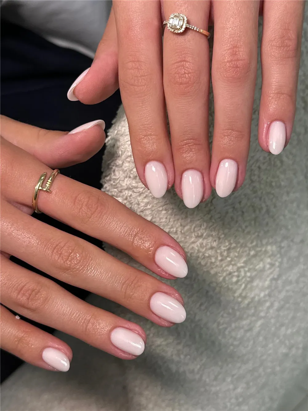 Short almond nails with glossy milky white polish