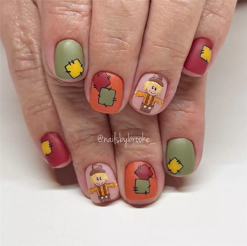 matte patchwork and scarecrow nails design