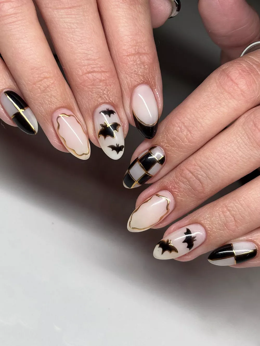 gold chrome Bat and Checkered Nail Art